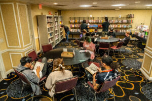 The manga lounge at Animé LA, with attendees enjoying a good read or looking for something new to enjoy!