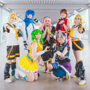 Photo of the idol group Deco*Pro, posing together while dressed as characters from the Vocaloid franchise